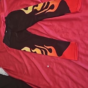 Brand new black leggings with red, orange and yellow flames.